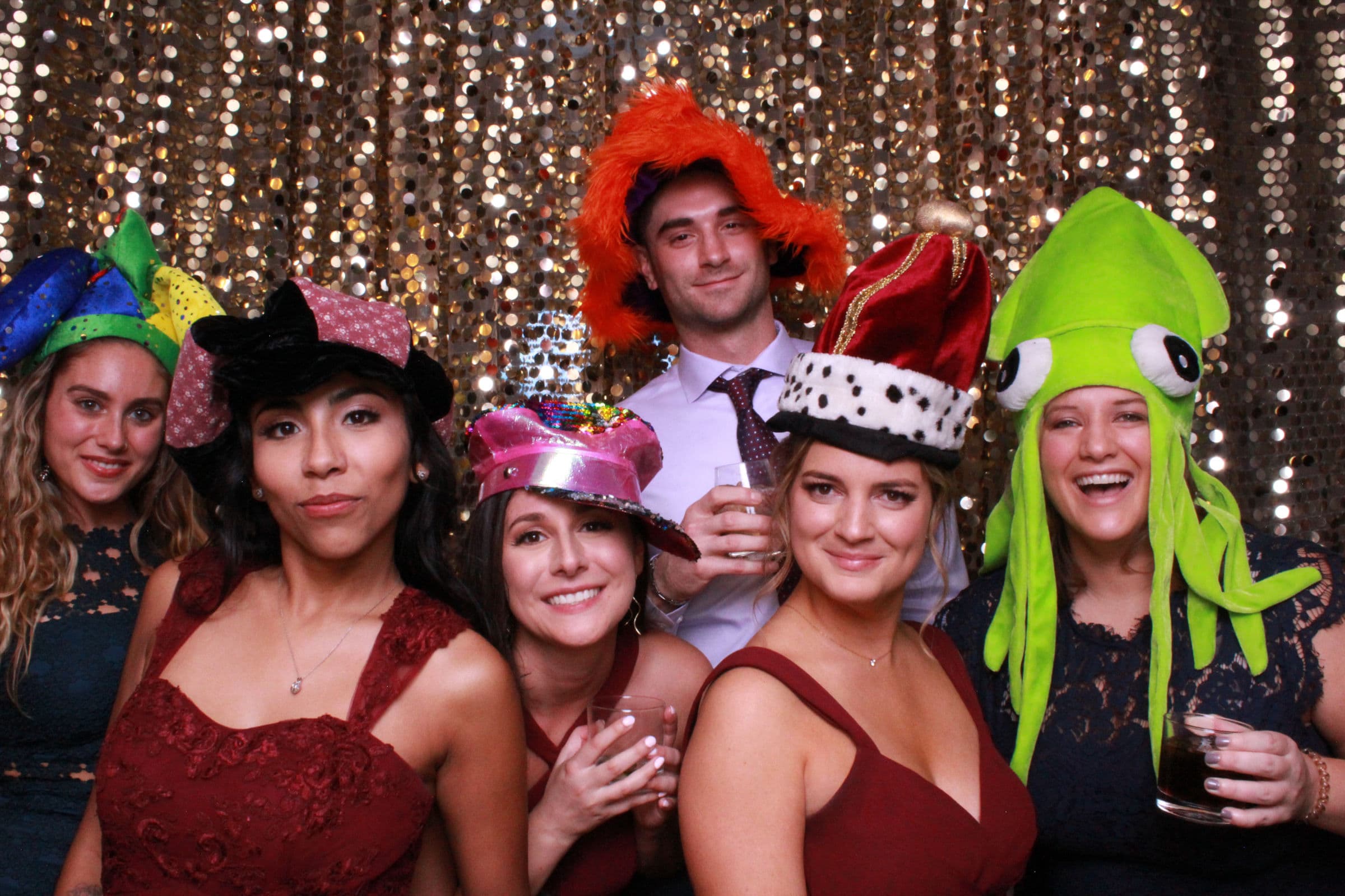 Guests posing with props at a photo booth