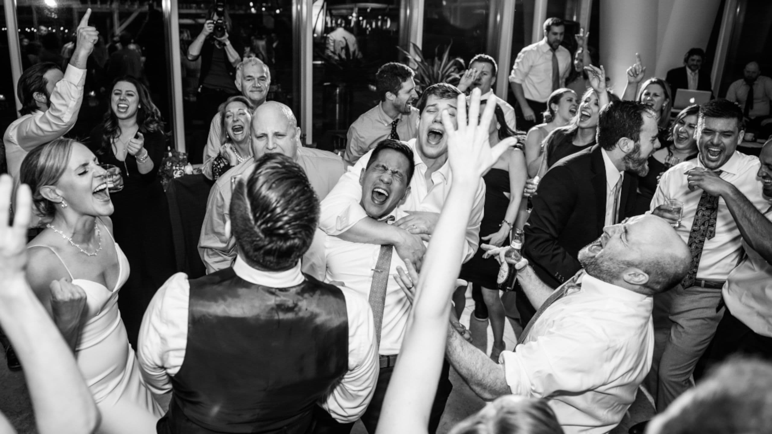 Happy couple on a packed dance floor